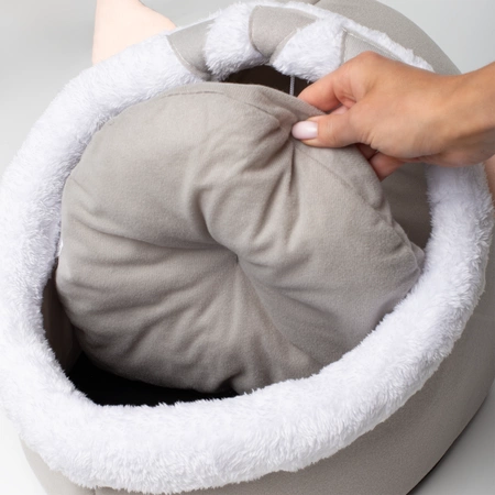 A cozy cat house with a removable cushion