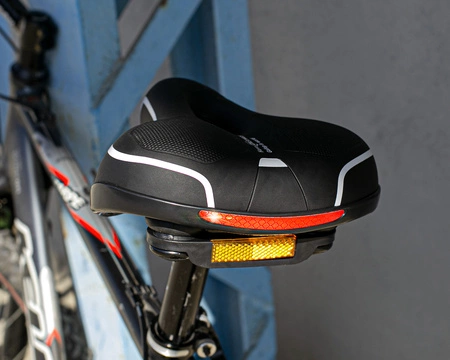 Siodełko rowerowe szerokie amortyzujące z odblaskami RS7 białe